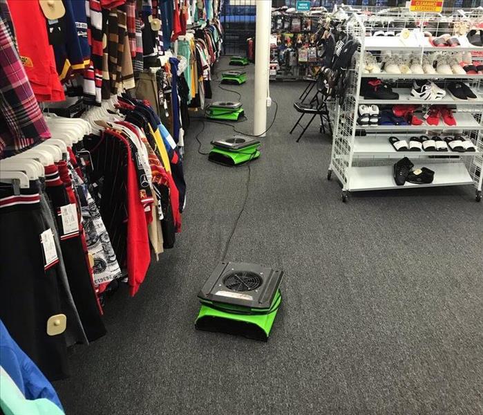Saturated carpet in retail store due to flood loss 
